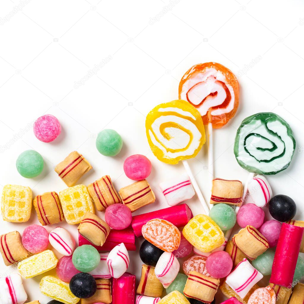 Pastel colored sweets isolated on white background