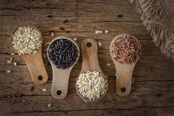 Different Types Rice Wooden Spoons Royalty Free Stock Photos