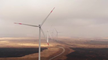 Drone fly above wind turbines field