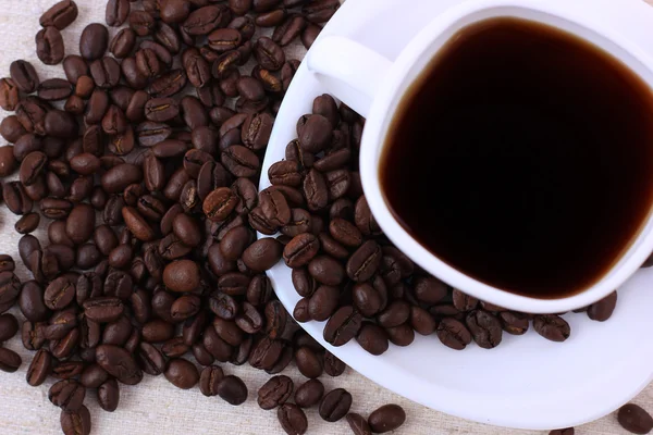 Cup of hot drink with coffee beam's — Stock Photo, Image