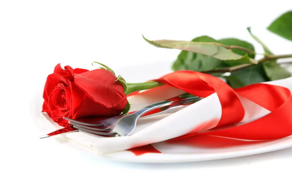 Closeup of red rose and cutlery on white plate — Stock Photo, Image