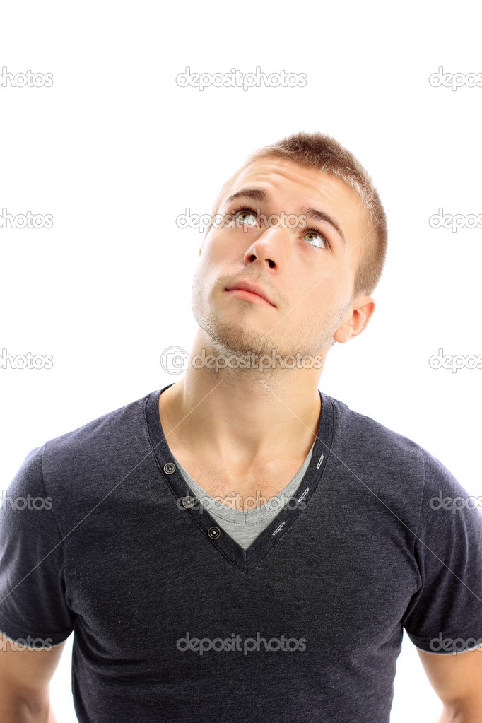 Young man looking up isolated