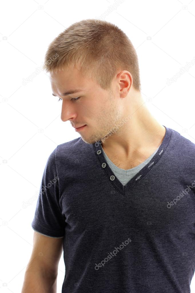 Young man looking down isolated