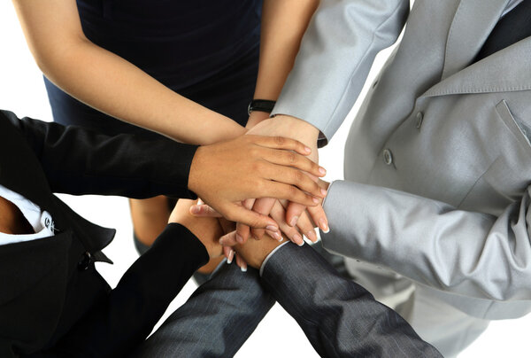 Image of business partners hands on top of each other symbolizing companionship and unity