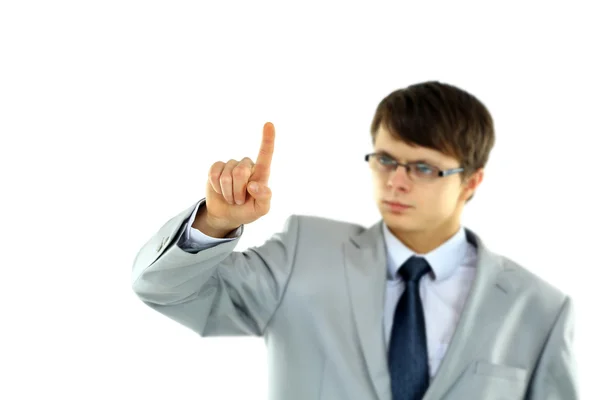 Jonge zakenman wijzend op iets geïsoleerde witte achtergrond — Stockfoto