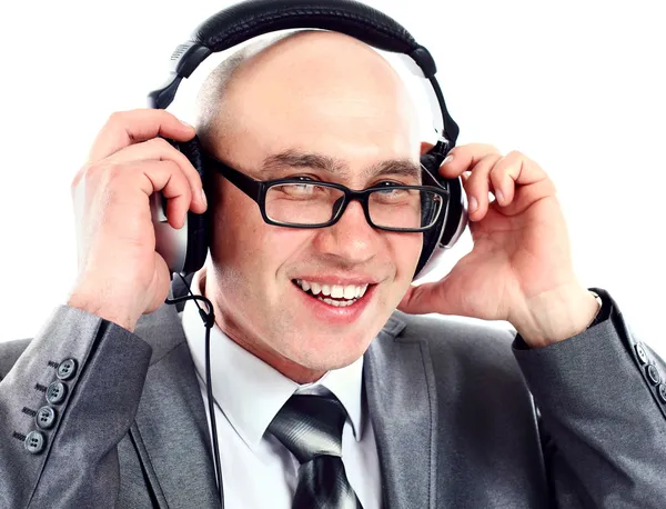 Homem de negócios usando fone de ouvido lutando para ouvir. Conceitos de comunicação . — Fotografia de Stock