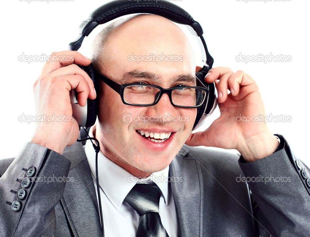 Businessman wearing earphone struggling to hear. Communication concepts.
