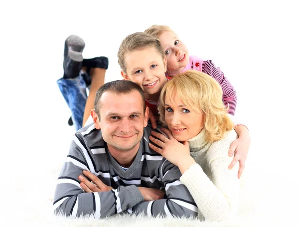 Happy family laying on the floor — Stock Photo, Image