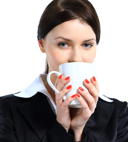 Pretty business woman standing, holding coffee mug, isolated on white. — Stock Photo, Image