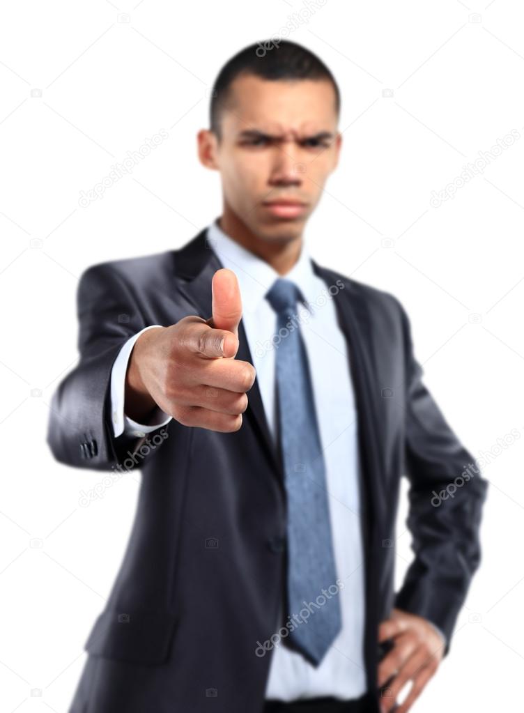 Portrait of serios african business man pointing at you against white background