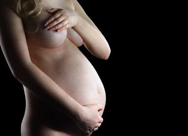 A naked pregnant woman on black background — Stock Photo, Image