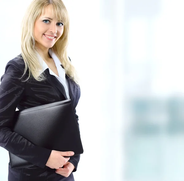 A portrait of a young business woman in an office — Stock Photo, Image