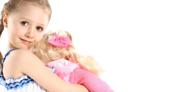 Menina com brinquedo boneca bebê — Fotografia de Stock