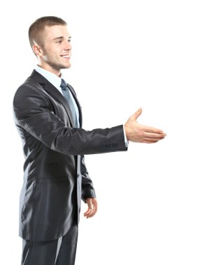 işadamı el sıkışma, tutun el karşılama jest, yakışıklı genç heyecanlı iş adam mutlu bir gülümseme giymek şık takım elbise ve kravat