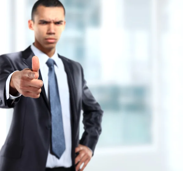 Serios business man showing finger to be number one — Stock Photo, Image