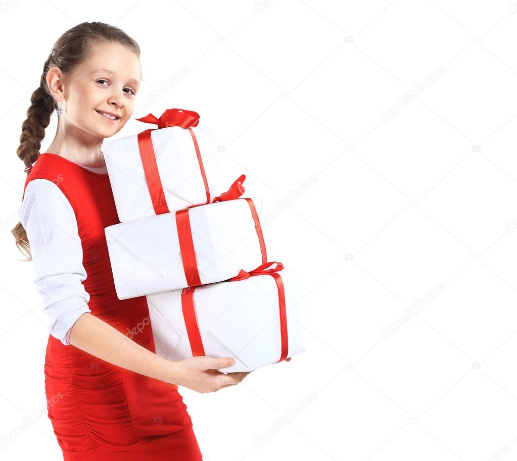 Portrait of happy little girl with gift boxes over white background