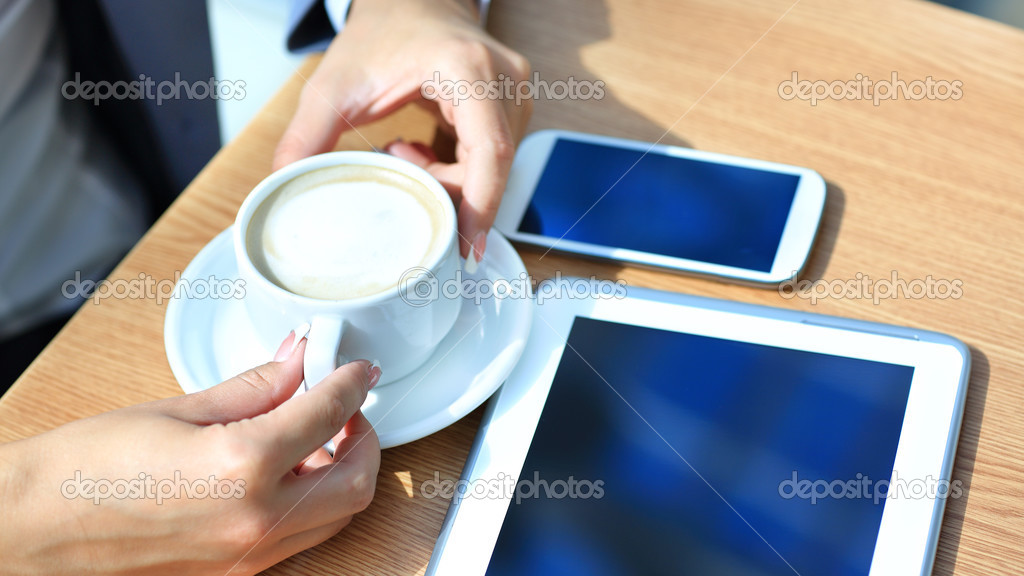Businessman using digital tablet computer with modern mobile phone. New technologies for success workflow concept.