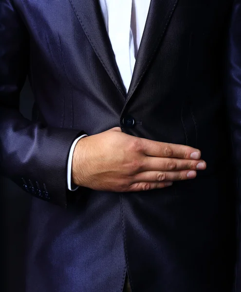 Close up of stylish man in elegant black suit — Stock Photo, Image