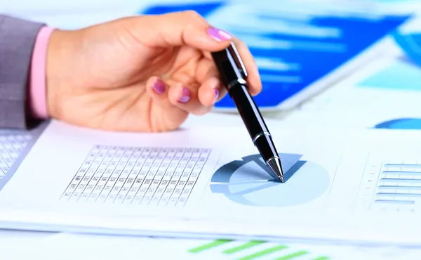 Image of female hand pointing at business document during discussion at meeting — Stock Photo, Image