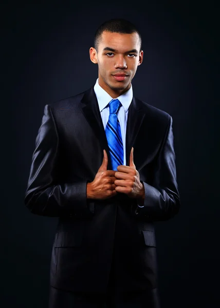 Young handsome African-American businessman in black suit. — Stock Photo, Image