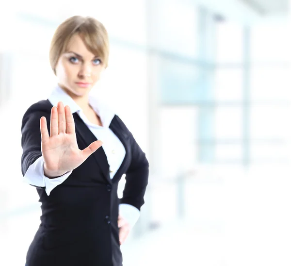 Blond businesswoman with stop hand sign gesture isolated on white. Business concept. Studio shot. — Stock Photo, Image