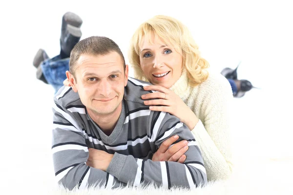 Close up of a couple lying on the floor looking at the camera — Stock Photo, Image