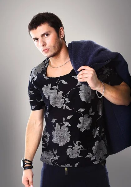 Fashion Shot of a young man with coat — Stock Photo, Image