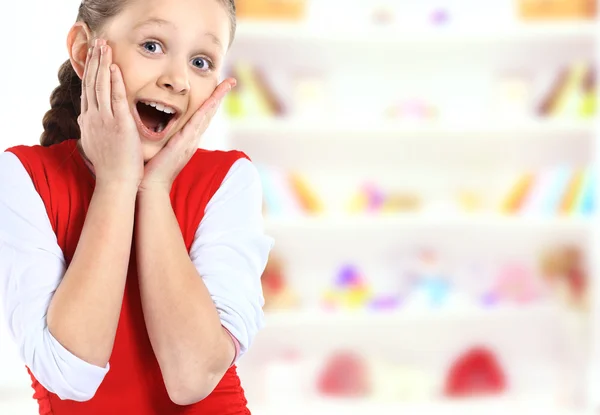 Surprised girl with hands up isolated on white — Stock Photo, Image