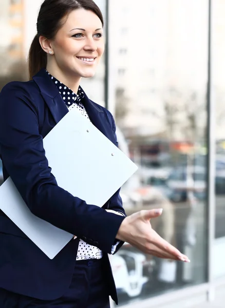 Business woman with arm extended for a handshake — Stock Photo, Image