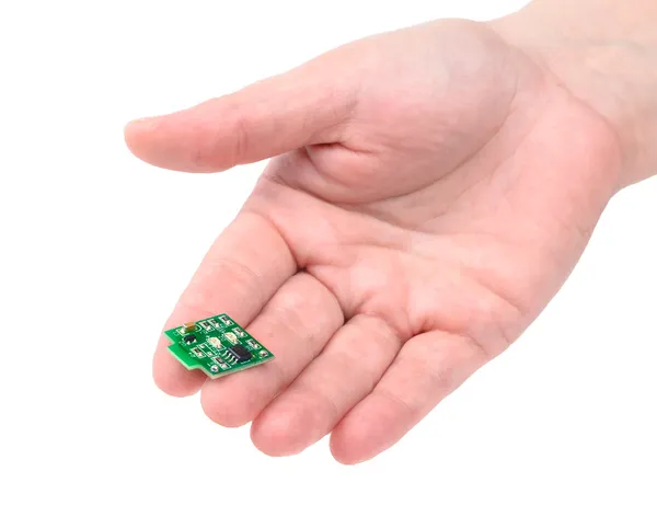 Miniature electronic circuit board on handground — Stock Photo, Image