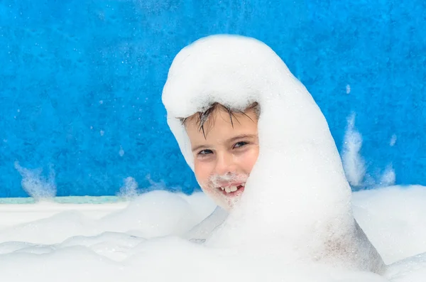 Boy swims in the bathtub — Stock Photo, Image