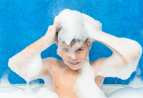 Boy swims in the bathtub — Stock Photo, Image