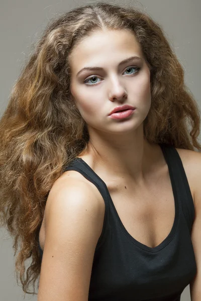 Beautiful sexy young woman with curly hair — Stock Photo, Image