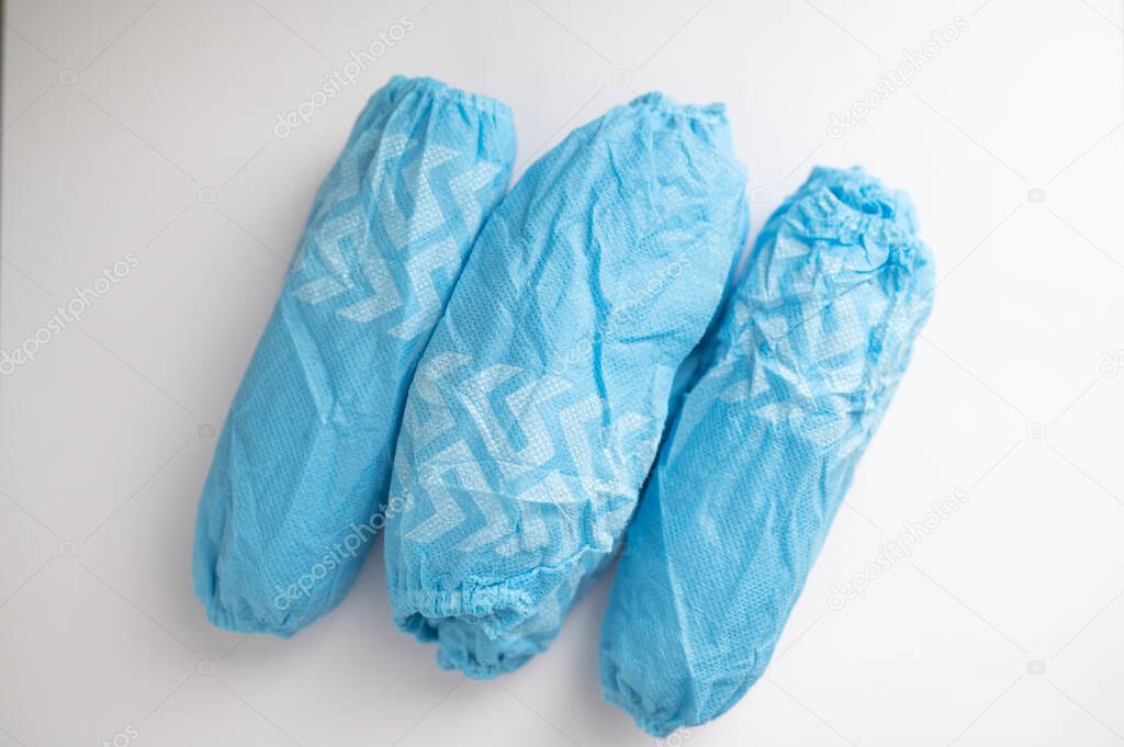 Unrolled medical shoe or foot covers.