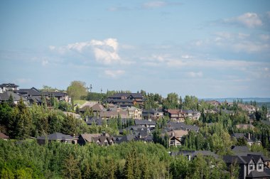 Views of new suburban construction encroaching on old farm acreages.