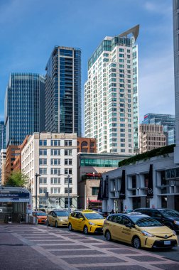 Vancouver, British Columbia, Canada - July 24, 2022: Taxi cabs bringing thousands of tourists to Vancouver's cruise terminal.