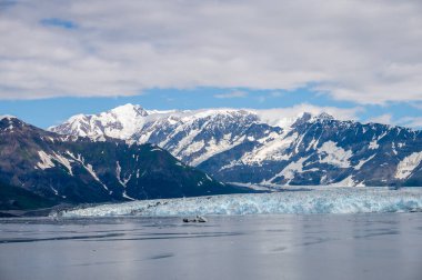 View of the famous Hubbard Glacier in Alaska. The Hubbar Glaicier is the largest tide water glacier in north america and a populare destination fro cruise ships. clipart