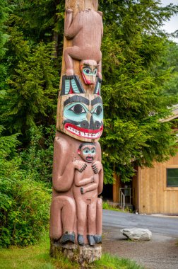 Saxman, Alaska - July 29, 2022: Tlinget totem poles, long house and traditional art.