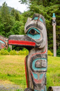 Saxman, Alaska - July 29, 2022: Tlinget totem poles, long house and traditional art.