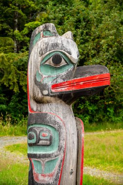 Saxman, Alaska - July 29, 2022: Tlinget totem poles, long house and traditional art.