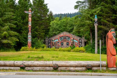 Saxman, Alaska - July 29, 2022: Tlinget totem poles, long house and traditional art.
