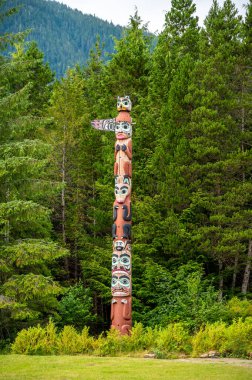 Saxman, Alaska - July 29, 2022: Tlinget totem poles, long house and traditional art.
