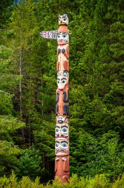 Saxman, Alaska - July 29, 2022: Tlinget totem poles, long house and traditional art.
