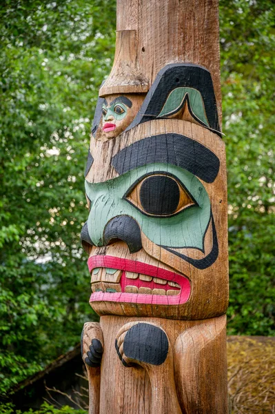 Saxman, Alaska - July 29, 2022: Tlinget totem poles, long house and traditional art.