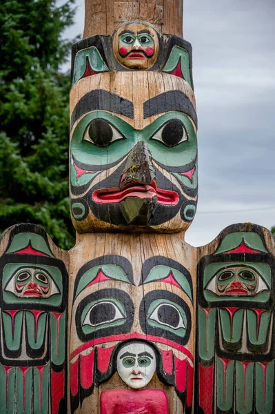 Saxman, Alaska - July 29, 2022: Tlinget totem poles, long house and traditional art.