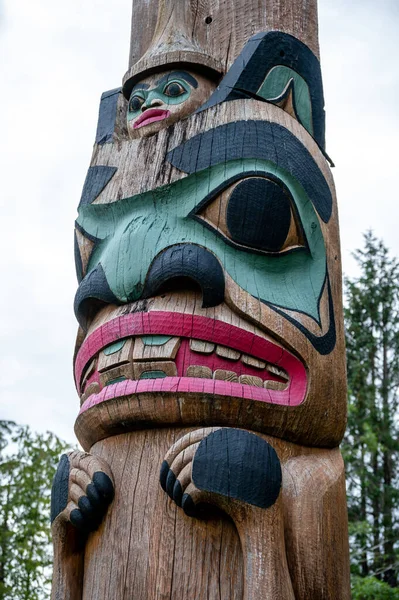 Saxman, Alaska - July 29, 2022: Tlinget totem poles, long house and traditional art.