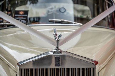 London, UK - August 21, 2022: Rolls-Royce classic car decorated for a wedding outside St Pauls Cathedral in London.