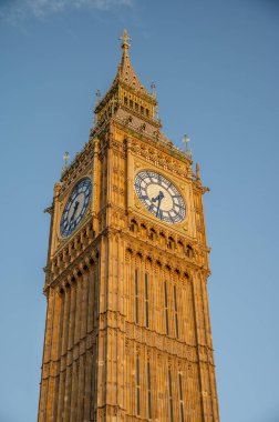 Big Ben, London, UK. A view of the popular London landmark, the clock tower known as Big Ben in evening light against a blue sky.