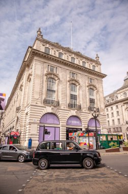 London, UK - August 22, 2022: People and traffic on the Picadilly Circus. This is a famous place in London's West End it was built in 1819 to join Regent Street with the shopping street of Picadilly.