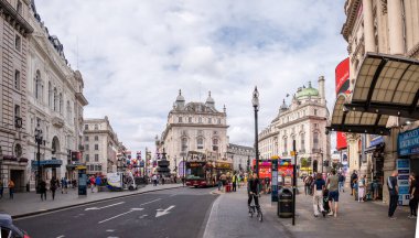 London, UK - August 22, 2022: People and traffic on the Picadilly Circus. This is a famous place in London's West End it was built in 1819 to join Regent Street with the shopping street of Picadilly.